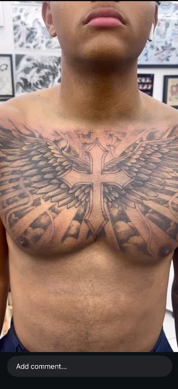 Benson Carlos black and gray cross with wings tattoo, Hawaii