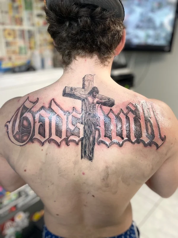 Benson Carlos black and gray realism crucifix tattoo on back, Hawaii