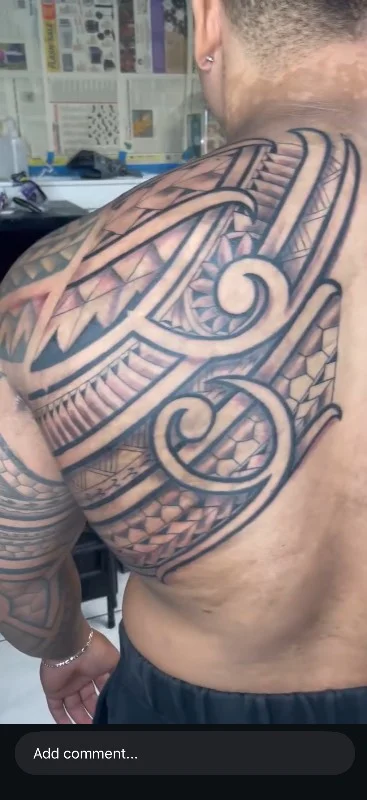 Benson Carlos Polynesian tribal tattoo on shoulder and back, Hawaii