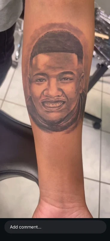 Benson Carlos black & gray realism portrait tattoo on forearm in Hawaii